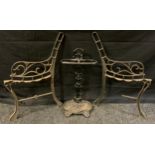 A Victorian style cast iron stick stand, 55cm high, 28cm wide; pair of cast iron scrollwork garden