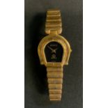 A Gucci 7000 Horseshoe gold plated bracelet watch, black dial, quartz movement, gold plated case and