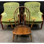 An Ercol Windsor arm chair; a pair of Parker Knoll button back arm chairs (3)