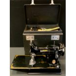 A Singer 221K1 featherweight portable sewing machine, model CAK 6-11, dated 1958, serial number