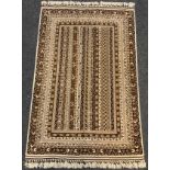 A hand-made Telle Torkaman rug / carpet, woven in muted tones of umber, brown, and cream, 190cm x