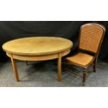A mid century oval coffee table and a nursing chair with wicker seat (2)
