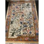 A large Chinese silk rug/carpet, retailed by Selfridges, central multi tone floral bamboo panel,