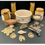 A large Baird & Tatlock stoneware bowl; two storage jars; two shell cases; horse brasses; shell case