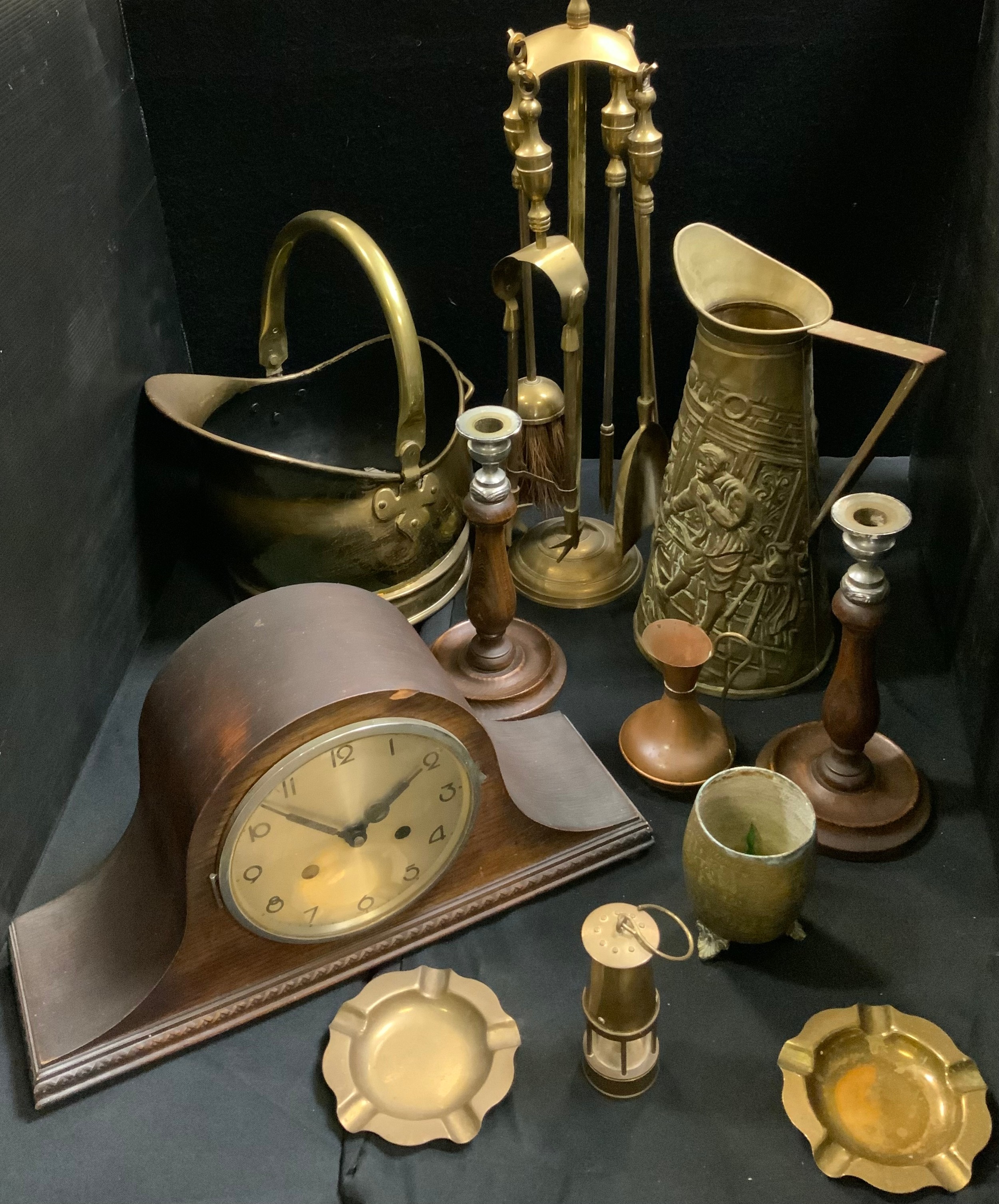 A fire side companion set; a brass coal scuttle; an oak mantel clock; oak candlesticks; etc