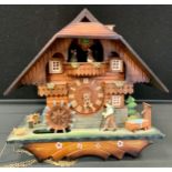 A German cuckoo clock, with Swiss Musical movement, 20th century