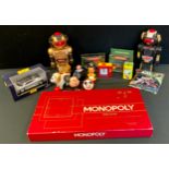 Toys - a Magic Mike II robot in black; another gold; Deluxe Monopoly; Maisto Jaguar XJ220 car;