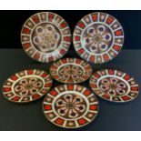 A Royal Crown Derby 1128 pattern dinner plate; another; four similar dessert plates (seconds)
