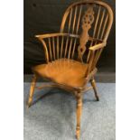 A 20th century wheel back Windsor chair, 100cm high, 53.5cm wide