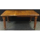 A Victorian mahogany extending dining table, rectangular top with canted corners, turned legs, 149cm