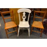 An early 20th century white painted kitchen chair; two bedroom chairs, wickers seats (3)