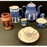 A Wedgwood blue Jasperware coffee pot and cover; a similar jug; pepper pot'' etc; a Coalport cup and