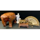 A bronze coloured metal figure, Water buffalo and child; blanc de chine figure; fan mirror ;