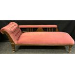 A late Victorian mahogany chaise longue, upholstered in pink, turned spindles and feet, c.1870, 65cm