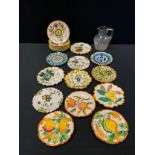 Continental pottery - Italian maiolica plates, assorted impressed ands painted marks; glass jug