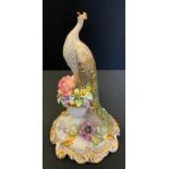 A Royal Crown Derby Golden Peacock, seconds