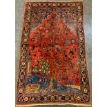 A Persian Farahan hand-knotted rug, the central field woven with a scene depicting Trees and