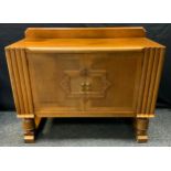 An Art Deco light oak two door sideboard, fitted interior, 90cm high, 122cm wide, 50cm deep.