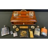 An Edwardian oak standish, two inkwells, pen trays, above base drawer; Ronson dial front pocket