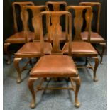 A set of six Queen Anne-style, Victorian oak dining chairs, vasular splats, cabriole legs, leather