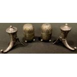 A pair of Victorian silver spirally fluted pepper pots, 5cm, Birmingham 1880, 49g; a pair of