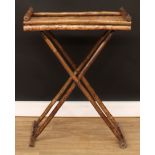A bamboo tray on stand, 88.5cm high overall, the tray 67.5cm wide and 40cm deep