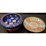 A Japanese cloisonne compressed circular bowl on hardwood stand, 25cm diameter; a Japanese kutani