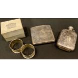 A silver cigarette case, Birmingham 1930, 119g; a pair of silver napkin rings, Birmingham 1972, 32g;