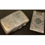 A George V silver rounded rectangular cigarette case, chased and engraved, vacant cartouche, 8cm,