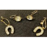 A pair of 9ct gold horseshoe earrings; a pair of gold coloured metal earrings (4)