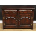 A George III Revival low dresser, rectangular top above a pair of short drawers and two raised and