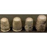 A George V silver thimble, Charles Horner, Chester 1914; other silver thimbles (4)