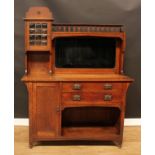 An Arts & Crafts oak sideboard, shaped superstructure with leaded bubble-glazed cabinet, gallery and