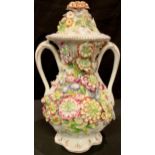 An early 19th century English porcelain Rococo Revival vase and cover, in the Manner of