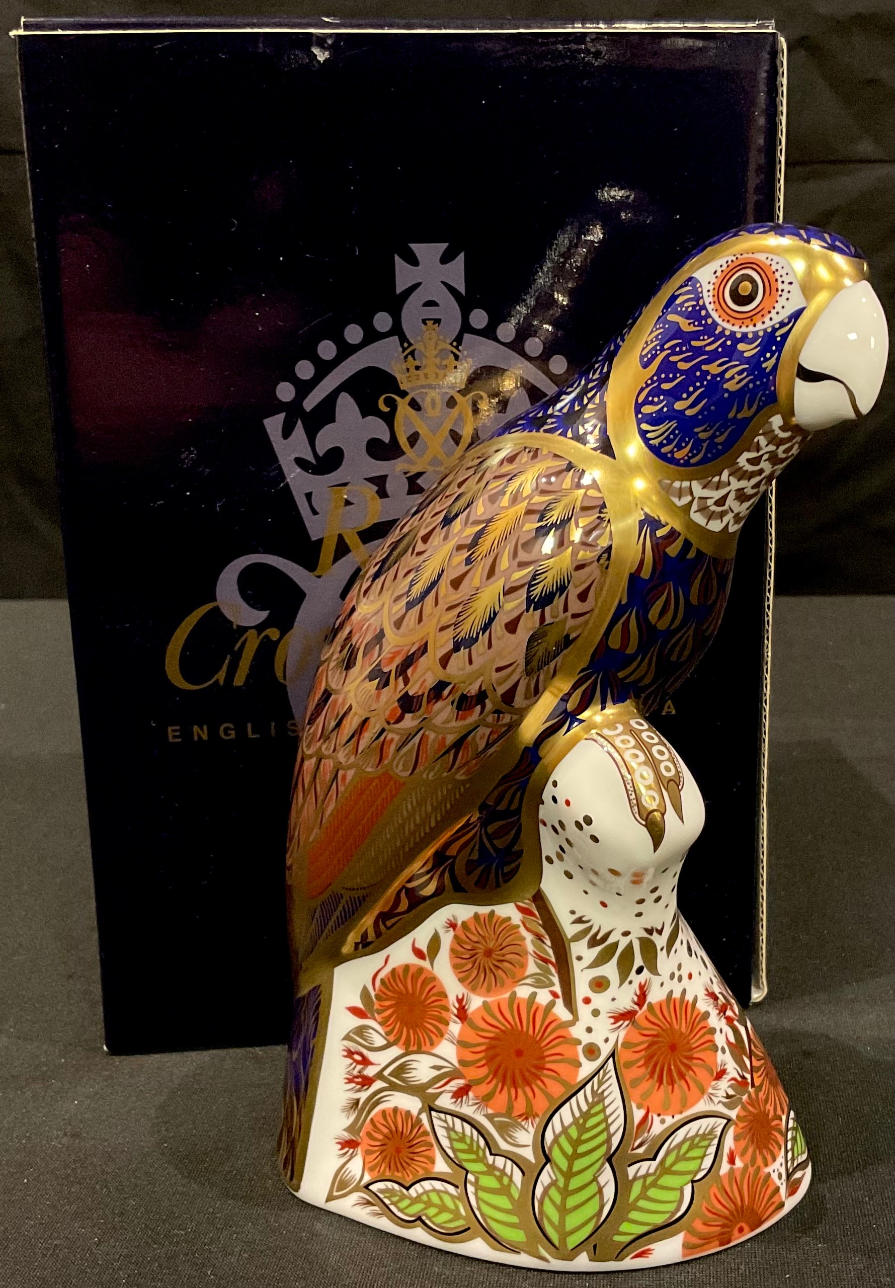 A Royal Crown Derby paperweight, Bronzed Winged Parrot, gold stopper, certificate, boxed