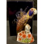 A Royal Crown Derby paperweight, Bronzed Winged Parrot, gold stopper, certificate, boxed