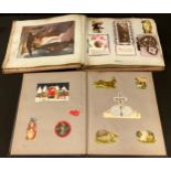 An Edwardian greetings card catalogue repurposed as a scrap album containing greetings cards,