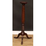 A 19th century mahogany torchère or statuary pedestal, circular top, reeded column, cabriole legs,