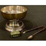 A George V silver pedestal sugar bowl, outswept gadrooned stepped base, 9.5cm diameter, 7cm high,