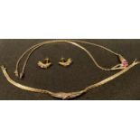 A 9ct gold suite comprising necklace set with diamond chips and garnets, conforming bracelet and