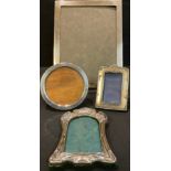 An Edwardian silver rectangular photograph frame, 24cm x 18.5cm, London 1906; an Art Nouveau