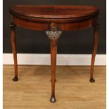 A George II Revival demilune card table, hinged top enclosing a baize lined playing surface,