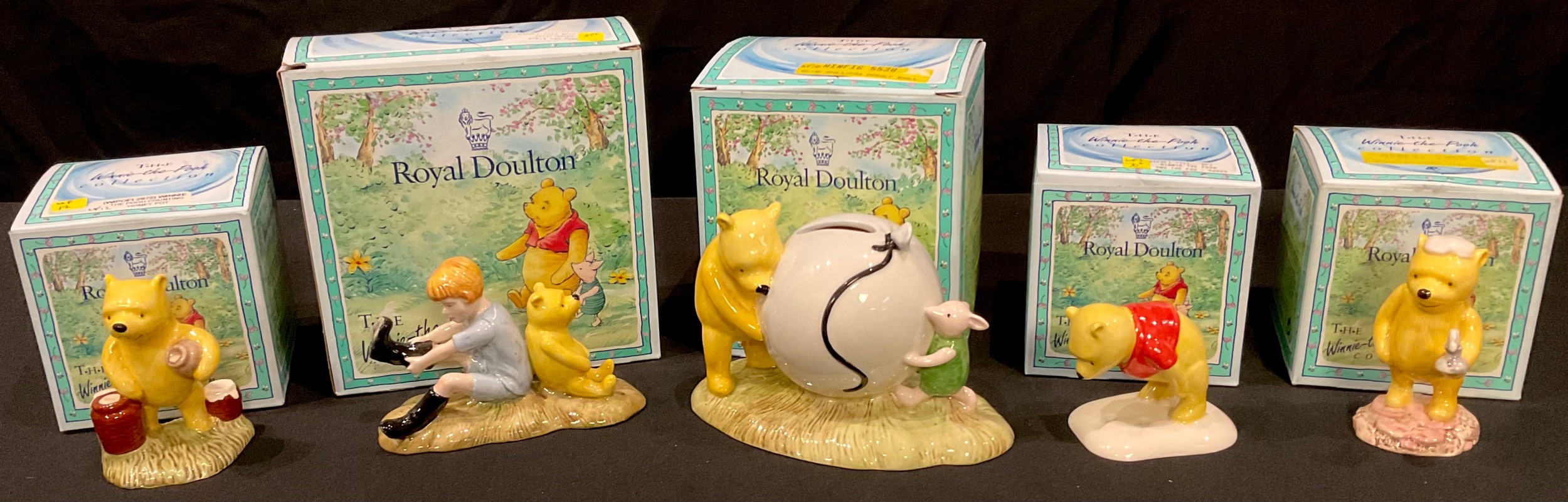 A Royal Doulton Winnie The Pooh model, Christopher Robin and Pooh WP10, 70 Years backstamp, boxed;