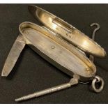 A Victorian silver reeded oval vesta case, with integral propelling pencil, steel pocket knife and