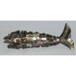 An abalone shell novelty bottle opener, as an articulated fish, 20cm long