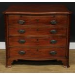 A George III Revival mahogany serpentine bachelor?s chest, slightly oversailing top above a slide