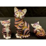 A Royal Crown Derby paperweight, Cat, gold stopper, two others, Seated Kitten and Playful Kitten,