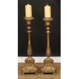 A pair of large ecclesiastical floor-standing brass pricket candlesticks, 103cm high (2)