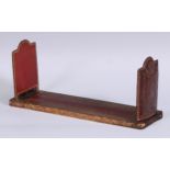 An Edwardian red morocco rounded rectangular adjustable book slide, by Dreyfous, Mount Street,