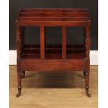 A George III mahogany three-section Canterbury, ring-turned supports and legs, brass casters, 54cm